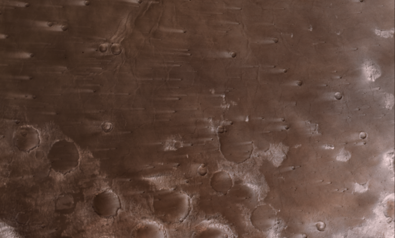NASA’s Psyche Mission Spies Mars’ Wind-Blown Craters During Close Approach