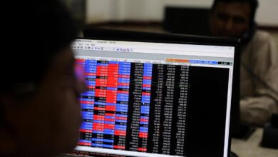 Stock markets turn flat in volatile trade